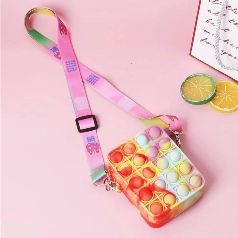Pop-it crossbody. Tie dye color with adjustable cloth strap.